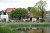 Blick auf das Anwesen &uuml;ber den Schlossteich hinweg.